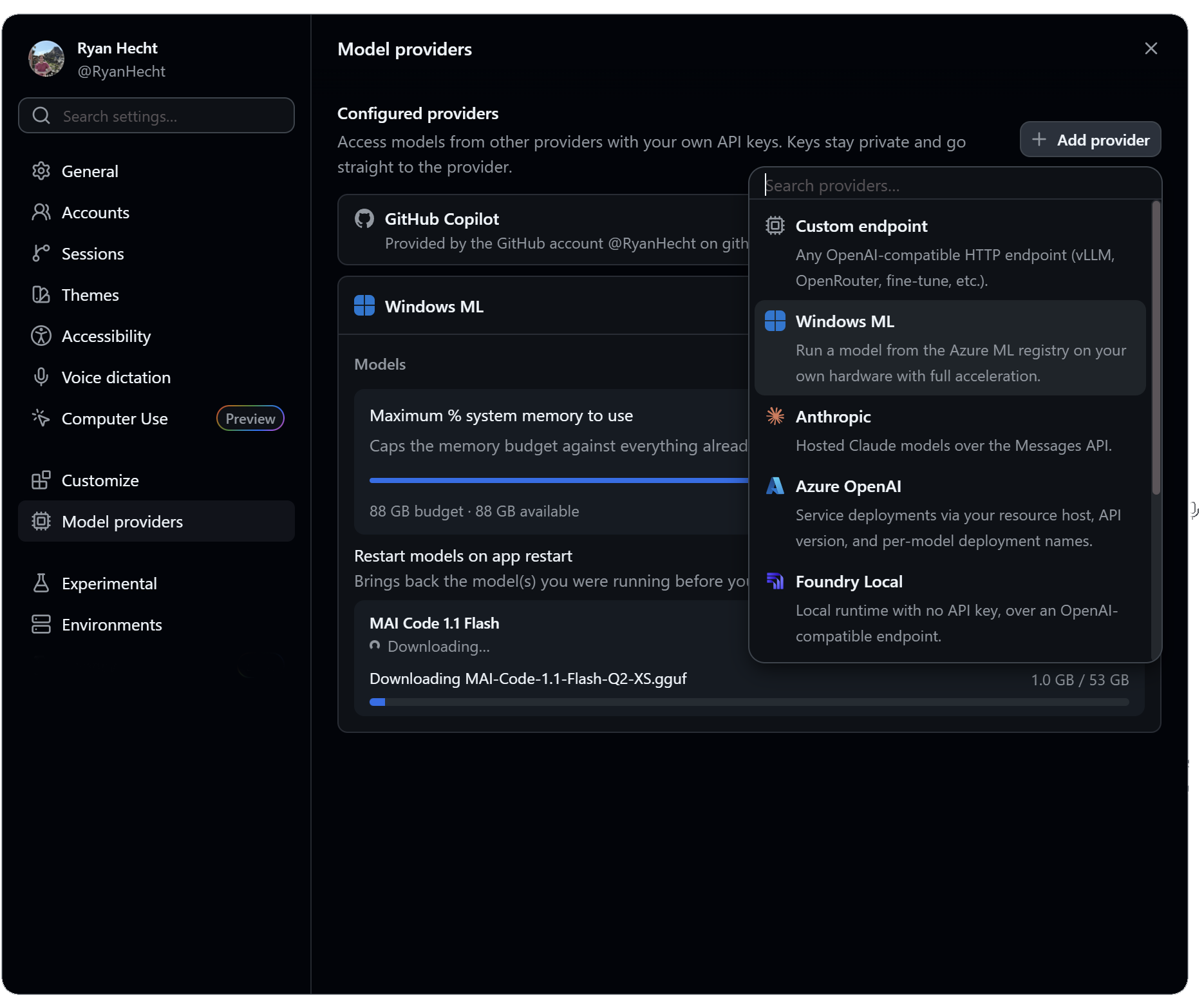 Caption: The Copilot app’s model provider settings. Custom endpoint takes any OpenAI-compatible HTTP endpoint (vLLM, OpenRouter), Windows ML runs registry models on your own hardware with full acceleration, and the screenshot catches MAI Code 1.1 Flash downloading as a 1.0 GB GGUF. Screenshot: GitHub.
