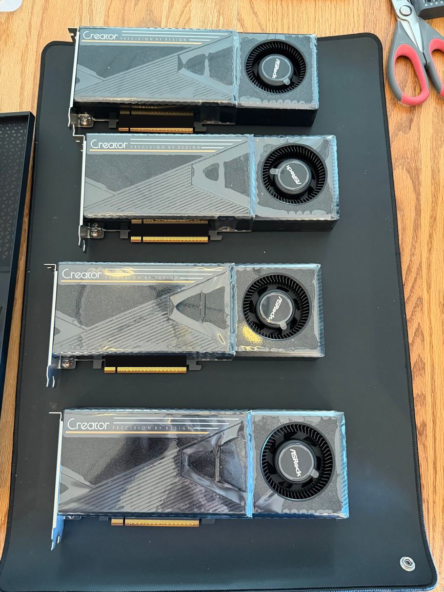The four R9700 Creator cards before install: blower-cooled, bracketed, 32 GB each. (Photo: Nick Reese, from his public build guide)